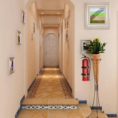Heavy Duty Fire Extinguisher Wall Mount Bracket For 5 Pound Extinguishers, Steel Construction, holding extinguisher in hallway.