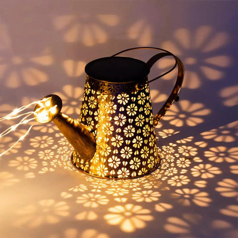Solar Powered Watering Can Lantern With LED Lights For Garden Decor casting floral glow pattern in dark setting