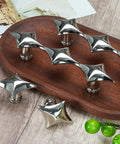 Spruce Up Your Day To Day Kitchen Cabinets Or Lazy Sunday Bathroom Vanities With These Clean Star Design Drawer Pulls In Crisp Silver Finishing. Modern star-shaped silver drawer pulls on a wooden tray.