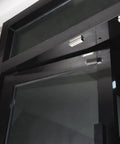 Heavy Duty 70lb Magnetic Door Catch For Stainless Steel Cabinets And Drawers installed on a glass door in a modern setting.