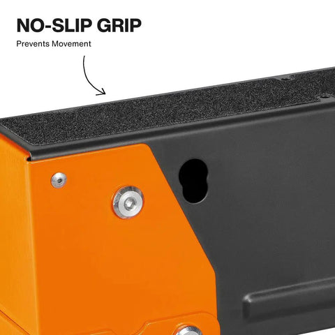 Close-up of Tough As Nails Folding Sawhorses non skid grip surface, showcasing orange and black metal construction.