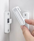 White Barn Door Latches With Adjustable 0 To 7 Millimeters Height For Flawless Gap Alignment And A Rock Steady 90 To 180 Degree Swivel Lock For Sliding Doors That Install Like A Breeze in use on a white door.