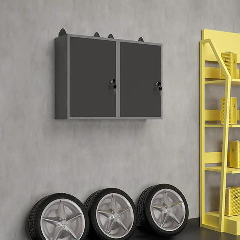 Heavy Duty Wall Mounted Storage Cabinet With Pegboard Upper Panel For Garage And Workshop Tool Organization Metal Hanging Cabinet In Black And Gray Finish Built Tough For Quick Easy Access Tool Storage And Serious Garage Ready Steel Build installed on a wall in a garage.