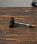 Dang Dependable M4 M5 M6 Tee Wing Bolt Knob Set on wooden surface, featuring black grip and silver threaded rod for tripod use.