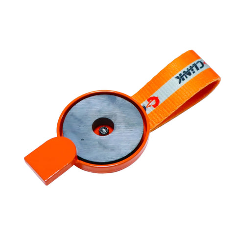 Front view of Dexter surge brake lockout key with magnet, orange circular head and orange strap.