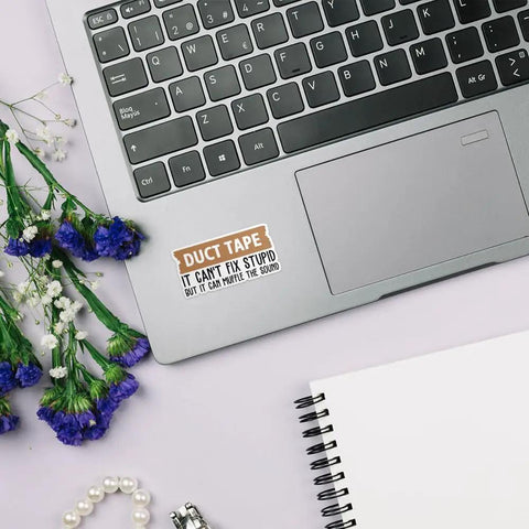3 Pack 3 Inch It Cant Fix Stupid But It Can Muffle The Sound Sticker Set on laptop keyboard with flowers and notebook