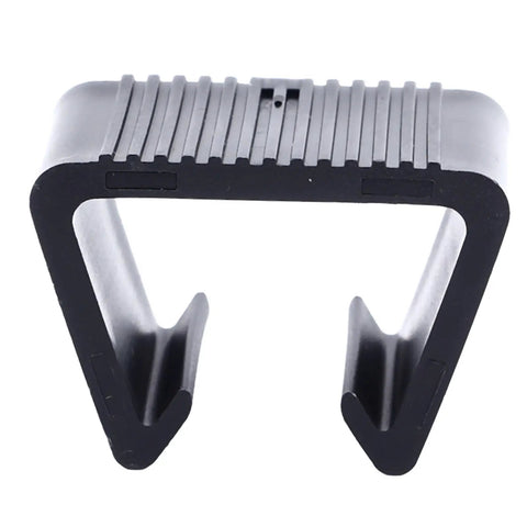 Close-up of a black plastic outdoor patio furniture clip from the 8 pack for sectional sofas and rattan couches.
