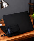 Stick On Dual Pocket SSD Carrying Case With Reusable Adhesive attached to laptop, showcasing organization solution for drives and accessories.