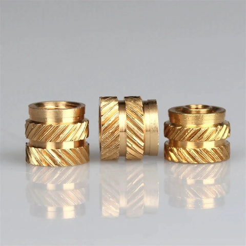 Get Your Hands On These Badass Knurled Insert Nuts Made From Solid Brass For Hot Melt Installation In Wood Or Plastic Strong Threads Hold Tight And Last Forever With M2 Through M6 Sizes Perfect For Any Serious DIY Job You Need Right Now - close-up view of brass insert nuts.