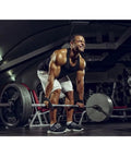 Man lifting weights with One Pair Lightweight Weightlifting Straps With Cotton Pads For Barbell Training, Tight Fit Hand Wraps