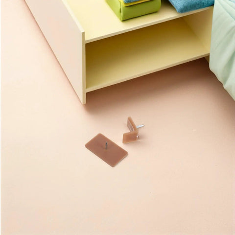 20 Piece Plastic And Iron Drawer Stopper Set for dressers and cabinets shown near a drawer with brown glide pads visible