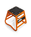 Matrix A2M Mini Bike Stand for 50 65 85 Models With Aluminum Construction Non Slip Pad and Wedge Top Keeps Your Bike Secure While Washing Orange Finish, side view