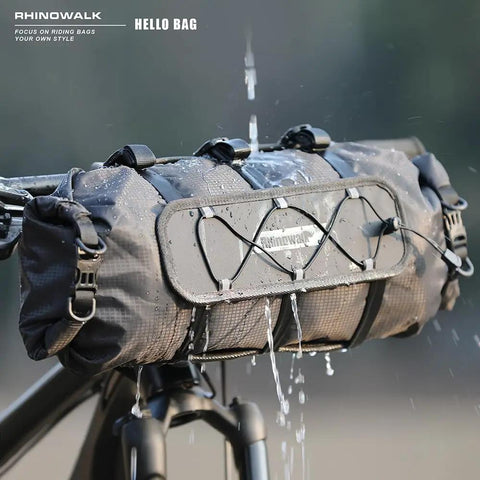 Ride-Ready Waterproof Handlebar Bag 12L Roll-Top Dry Bag With Front Panel And Removable Harness shown on bike in the rain