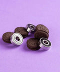 Flash Lightning Ceramic Roller Skate Bearings Pack Of 16 For Quad Skates ABEC 9 Ultra Fast And Tough Pre Lubed next to cookies