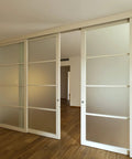 Sliding glass doors installed in a living room showcasing sliding door nylon pulley wheels 25mm for screen doors wardrobes cupboards closets.