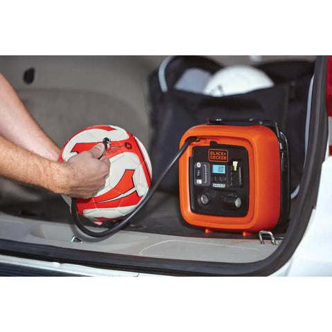 Inflating a soccer ball with 12V DC Multipurpose Inflator With Digital Gauge, High-Volume For Air Mattresses And Rafts, High-Pressure For Car And Bike Tires, Includes Deflate Function For Quick Cleanup, Dope Portable Auto Accessory in car trunk