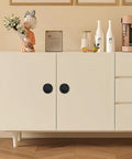 Four Pack Matte Black Recessed Ring Pull Handles For Cabinets And Drawers installed on white cabinet doors