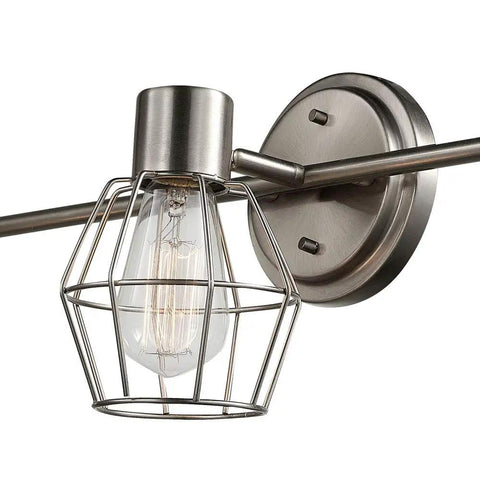 Close-up of the Cedrick 3 Light Track Lighting in Brushed Nickel with vintage Edison bulb and wire cage on adjustable head.