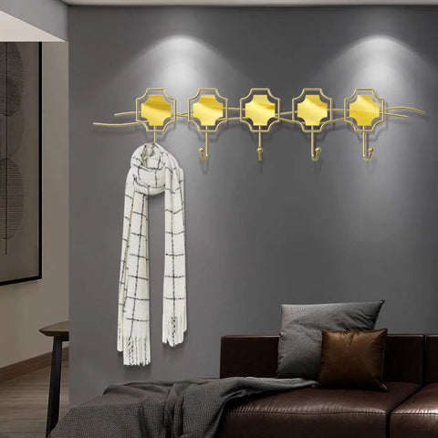 Top Shelf Wall Mounted Coat Rack With Five Heavy Duty Wrought Iron Hooks That Handle Every Jacket Key Backpack And Towel Without A Hitch While Adding A Smooth Modern Vibe To Your Entryway Organization Game with a white scarf displayed.