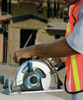 Worker using Lightweight Magnesium Hypoid Saw With Seven And One Quarter Inch Blade, 13.2 Lb Job Site Tough Power Tool on site