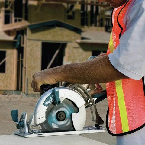 Worker using Lightweight Magnesium Hypoid Saw With Seven And One Quarter Inch Blade, 13.2 Lb Job Site Tough Power Tool on site
