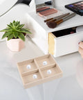 No Sweat Beige Velvet Jewelry Tray With Four Grid Compartments for quick sorting rings earrings and bracelets on a vanity.