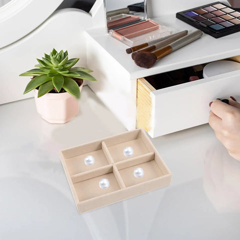 No Sweat Beige Velvet Jewelry Tray With Four Grid Compartments for quick sorting rings earrings and bracelets on a vanity.
