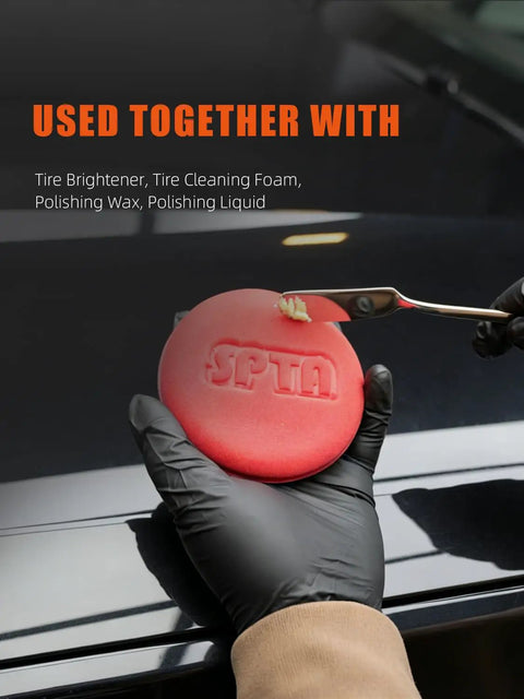 Close-up of 10 Pack Foam Wax Applicator Pads For Car Detailing, 4 Inch Red Hand Wax Pads being used on a car hood.