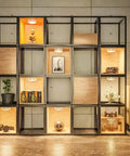 Six Pack LED Puck Lights With Remote Color Changing RGBW Under Cabinet Lighting installed in a display shelf illuminating decor.