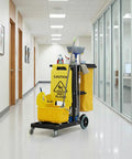 Front view of heavy duty cleaning cart on wheels for janitorial and custodial use heavy duty rolling supply organizer for housekeeping maintenance and maid services 440 LB capacity in hallway
