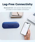 XSound Go Bluetooth Speaker With 16W Power placed on desk beside smartphone showing Bluetooth connectivity settings.