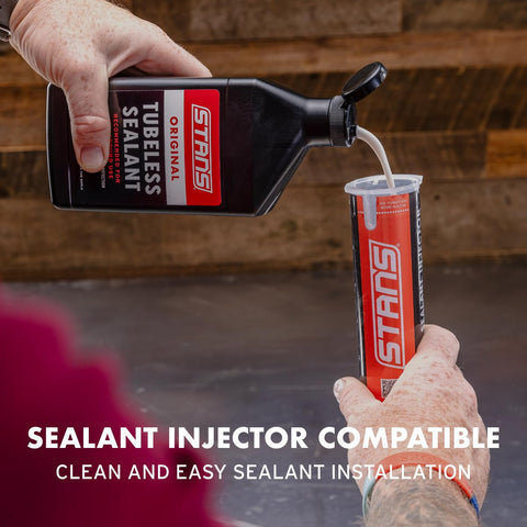 Ultra Fast Tubeless Tire Sealant For Bikes That Seals Punctures Up To Six Point Five Millimeters And Is Long Lasting For Mountain Road Gravel Cyclocross And Commuter Rides So You Stay Rolling being poured into a sealant injector for easy installation.