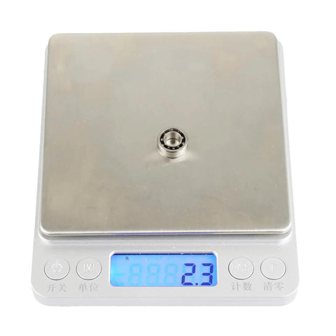 Ten Piece R188 Deep Groove Ball Bearings With Nylon Cages And C3 Clearance Optimized For Fidget Spinners on a weighing scale showing 2.3 grams.