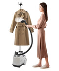 Woman using Pro Grade Garment Steamer 110V 1500W with Adjustable Steam Temperature on brown trench coat