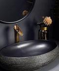 SDVantage Black Ceramic Bathroom Vessel Sink and Faucet Combo, oval countertop sink with textured design and modern faucet.