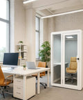 Rock Solid Soundproof Office Pod Featuring Tight Acoustic Sealing For Mobile Focus Booth in modern office setup with desks.