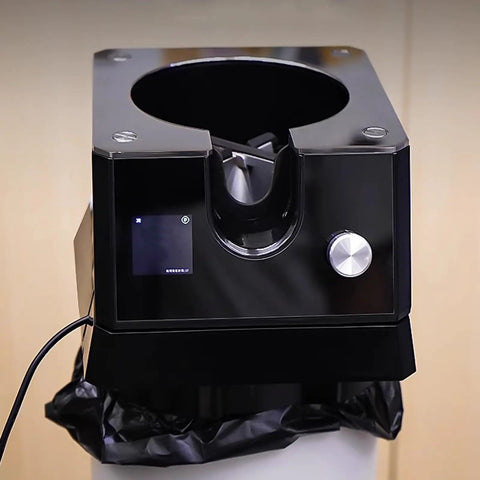 Slick Automatic Coffee Portafilter Cleaner And Espresso Grounds Knock Box Station Featuring Smart Optical Guard, top view with digital display.