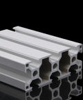 Premium Slick 3090 Aluminum Extrusion Profile 4 Pack 43.31 Inch Anodized Silver Rails showing multiple rods stacked on reflective surface.