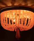 Candy Pink Acrylic Beaded Flush Mount Ceiling Light Three Light Chandelier In Rustic White Finish illuminated close-up view.