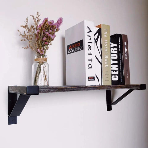 Heavy Duty 16 Inch Shelf Brackets With Lip Tough Industrial Wall Mount Metal Storage Brackets For Indoor Outdoor Use Rust Resistant Includes Screws 2 Pack Black supporting a wooden shelf with books and vase.