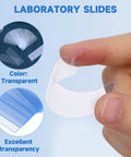 Clear Disposable Plastic Microscope Slides For Lab Samples And Classroom Science Wet Mount Practice 75 X 25 Mm Hands On Viewing Set For Easy Specimen Experiments In Education And Research. transparent slide held by hand