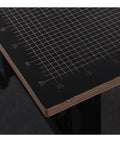 Close-up of Pro Grade Desktop Hot Wire Foam Cutter cutting mat with grid lines for precise foam shaping and DIY crafting