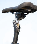 Close-up of bike suspension seatpost adjustable shock absorber for road gravel MTB and E bikes universal fit in 27.2mm 30.9mm 31.6mm.