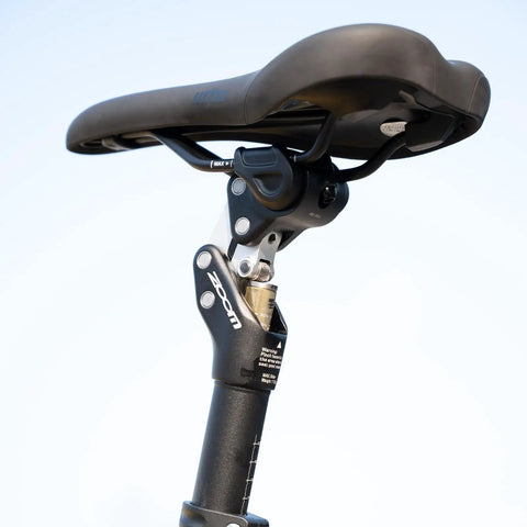 Close-up of bike suspension seatpost adjustable shock absorber for road gravel MTB and E bikes universal fit in 27.2mm 30.9mm 31.6mm.