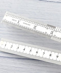 15 Cm Straight Ruler For Drafting And Math Class Double Sided Metal Tool with inch and cm markings on light background