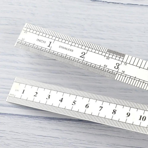 15 Cm Straight Ruler For Drafting And Math Class Double Sided Metal Tool with inch and cm markings on light background