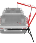 Heavy Duty Hydraulic Engine Hoist With Hitch Mount Truck Crane For 2 Inch Receiver Fully Adjustable Boom Red Finish in truck bed.