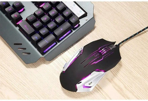 Top Tier Gaming Keyboard And Mouse Combo Featuring Colorful Breathing RGB Backlights And High Response Mouse, sleek design on wooden desk.