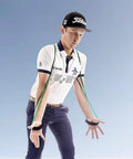 Person demonstrating TPro Green 2.0 Golf Swing Training Aid with heavy resistance bands for improved strength and posture.