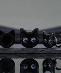 Black Cat Ear Gauges 5/8 Inch Stainless Steel Ear Tunnels with dope cartoon cat design and purple eyes on display